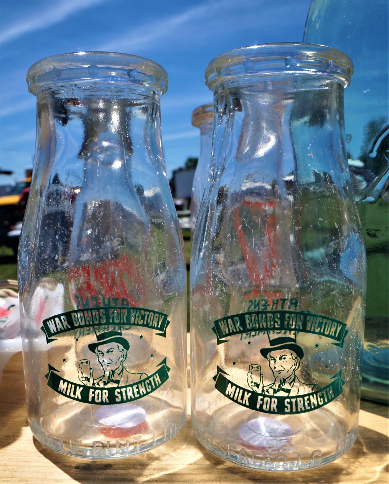 Patriotic World War II-era cream bottles on display at the Elkhorn Antique Flea Market